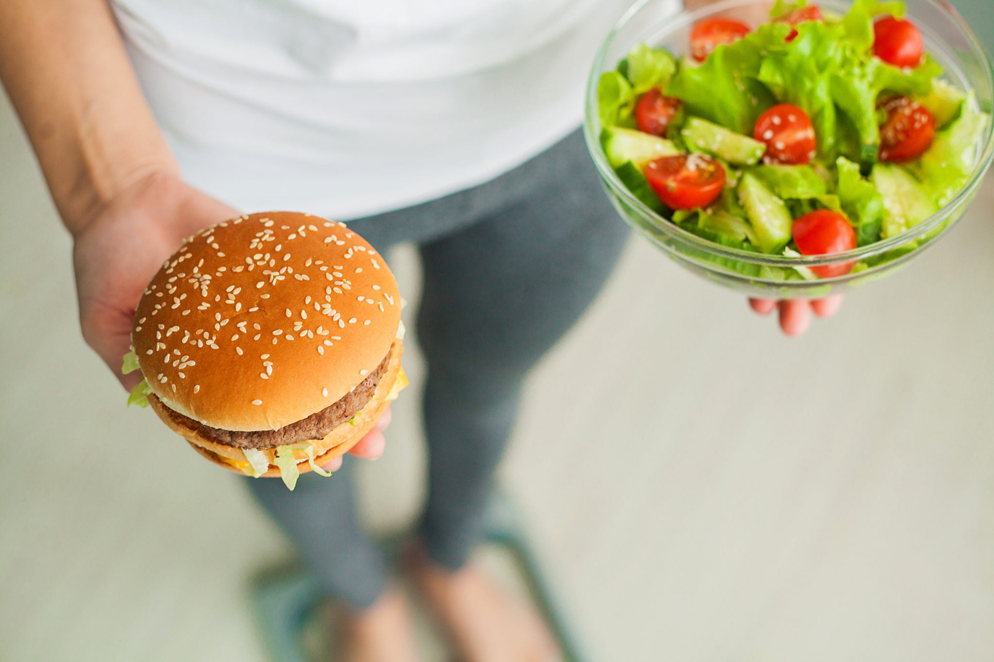 Sweets have been eaten. Hand hold Burger.